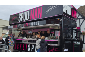 Spud Man jacket potato street food van with queues in the UK